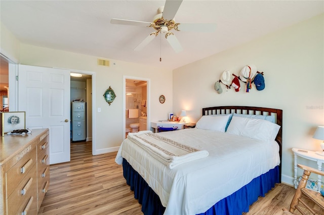 bedroom with ensuite bath, ceiling fan, and light hardwood / wood-style floors