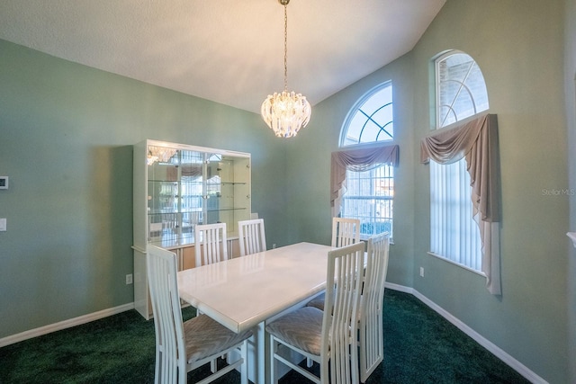 dining space featuring dark colored carpet and a notable chandelier