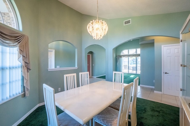 dining space featuring carpet flooring, a textured ceiling, vaulted ceiling, and a notable chandelier