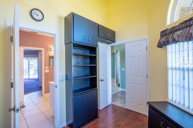 hallway with dark tile patterned floors