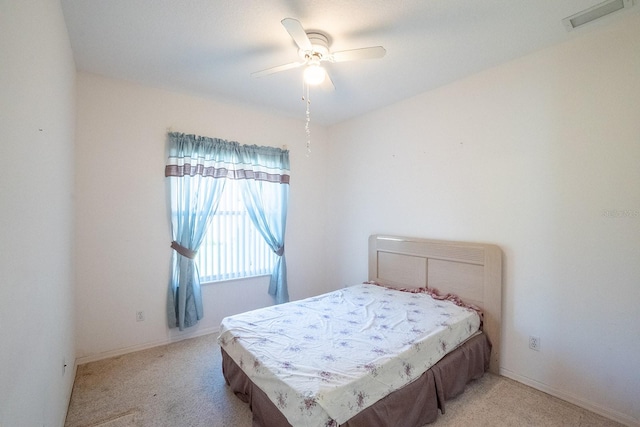 bedroom featuring ceiling fan and light colored carpet