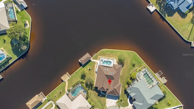 birds eye view of property featuring a water view