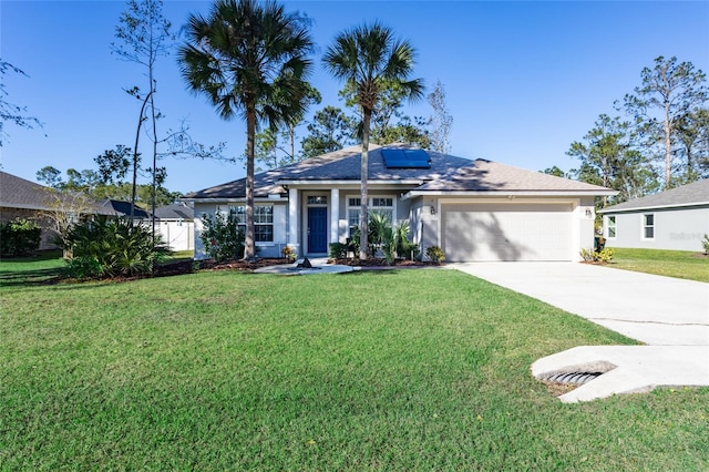 ranch-style home with a front yard, solar panels, and a garage