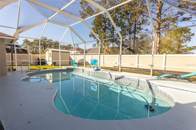 view of pool with a storage unit, a lanai, and a patio