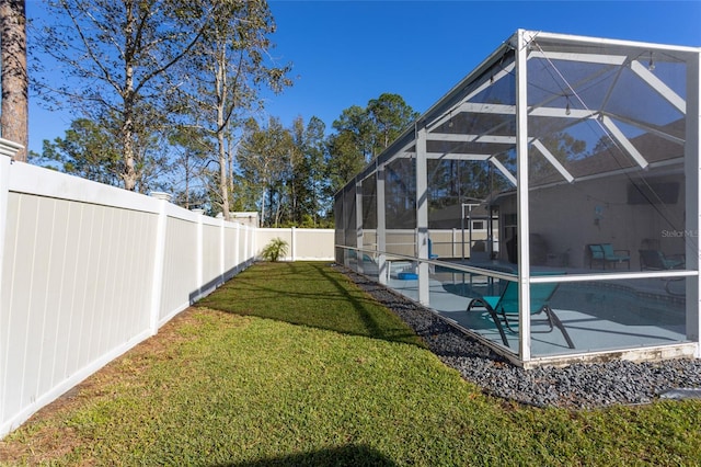 view of yard featuring a patio area, a lanai, and a fenced in pool