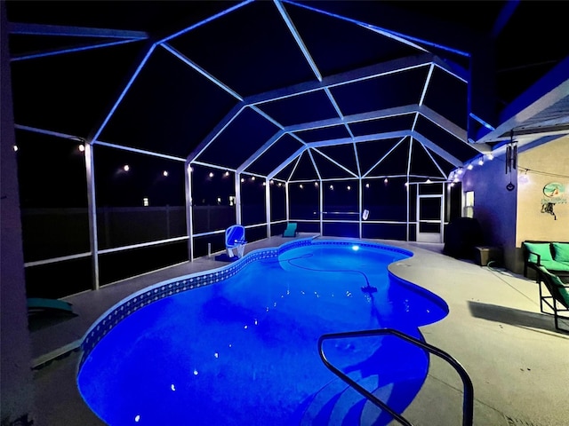 view of pool featuring a lanai and a patio