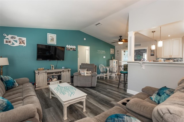 living room with ceiling fan, dark hardwood / wood-style flooring, and vaulted ceiling