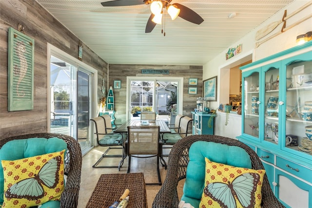 sunroom featuring ceiling fan