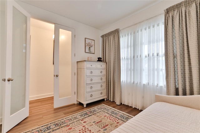 bedroom with wood-type flooring