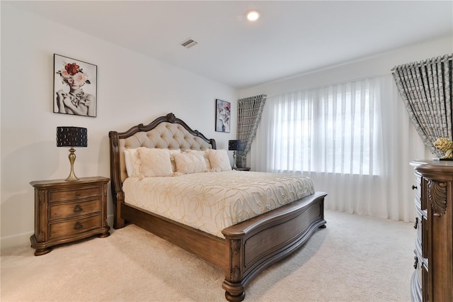 bedroom with light carpet