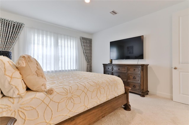 bedroom with light carpet