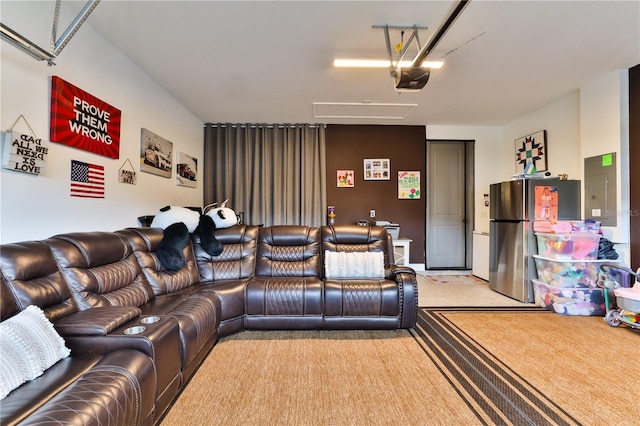 home theater room with light colored carpet and electric panel