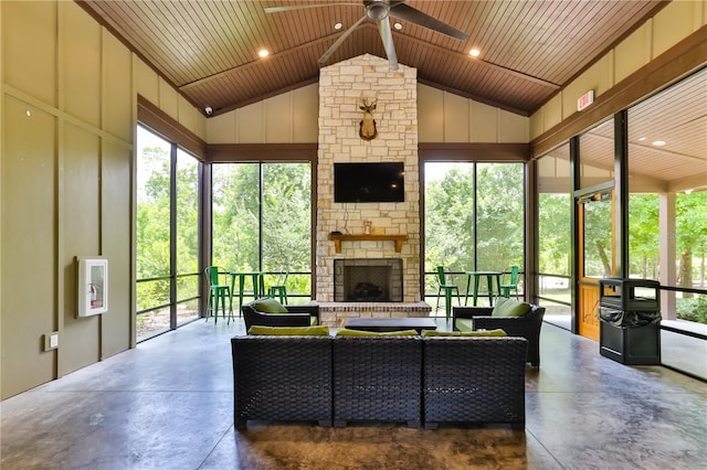 sunroom featuring a wealth of natural light, a fireplace, wood ceiling, and lofted ceiling