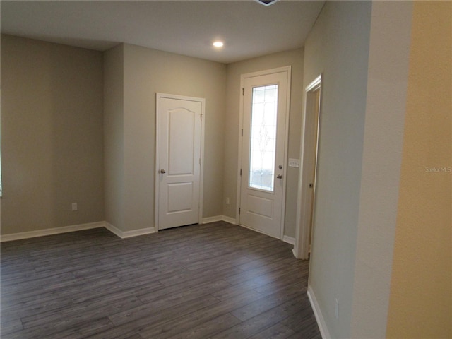 entrance foyer featuring dark hardwood / wood-style floors