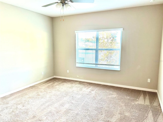 carpeted empty room with ceiling fan