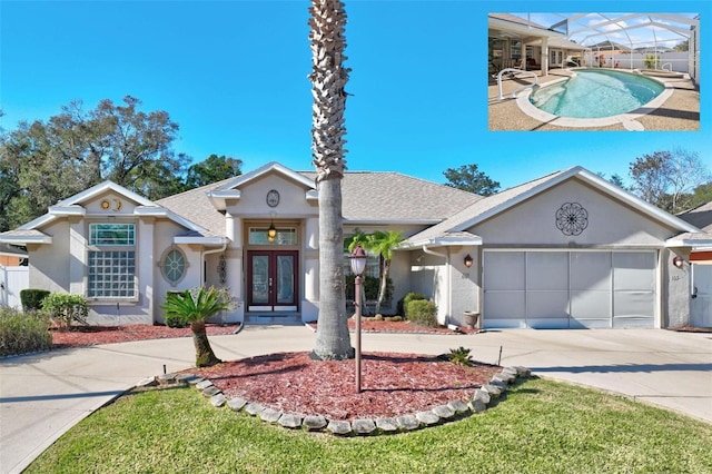 single story home with french doors and a garage