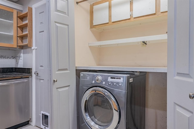 clothes washing area featuring washer / clothes dryer