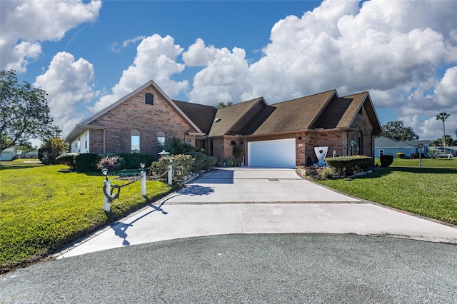 view of front of house with a front yard and a garage