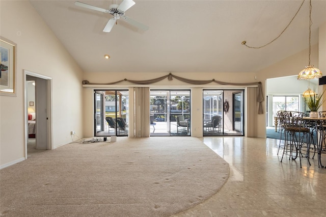 living room featuring ceiling fan and high vaulted ceiling