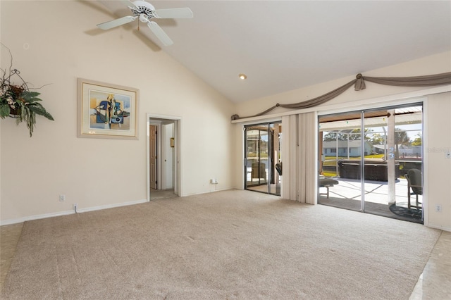 carpeted empty room featuring ceiling fan and high vaulted ceiling