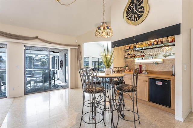 dining area with wet bar and a wealth of natural light