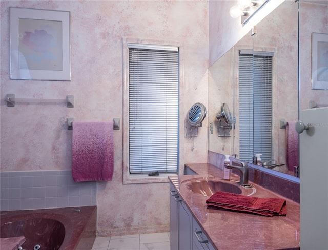 bathroom with vanity and a tub to relax in