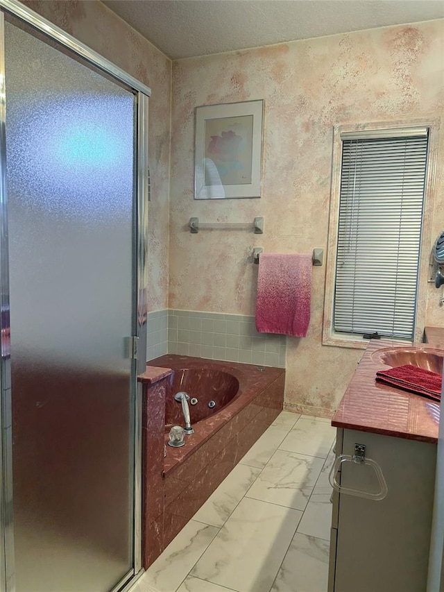 bathroom featuring vanity and separate shower and tub