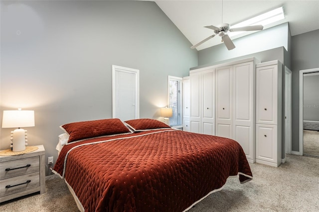 bedroom featuring light colored carpet, high vaulted ceiling, and ceiling fan