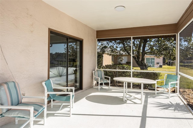 sunroom / solarium featuring a healthy amount of sunlight