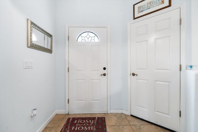 entrance foyer with light tile patterned floors