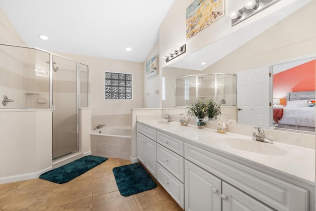 bathroom featuring tile patterned floors, vanity, plus walk in shower, and vaulted ceiling