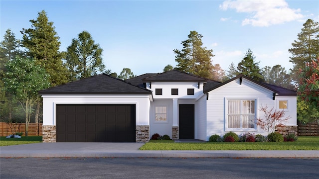 view of front of property featuring stucco siding, an attached garage, fence, stone siding, and driveway