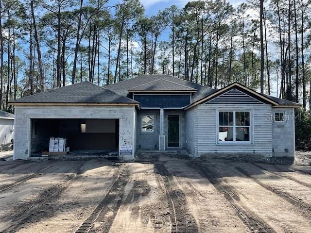 view of front of property with a garage