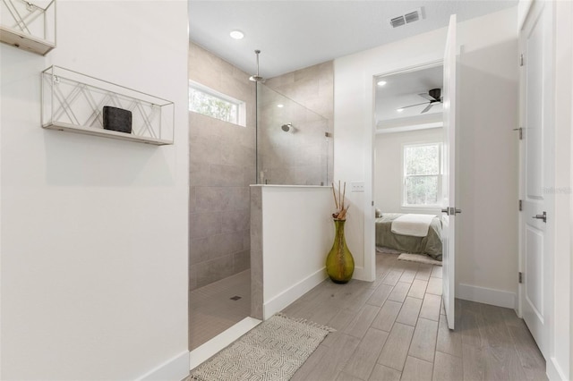 19 Essex Ln, Palm Coast, FL 32164 - bathroom with ensuite bathroom, visible vents, ceiling fan, wood finish floors, and a walk in shower