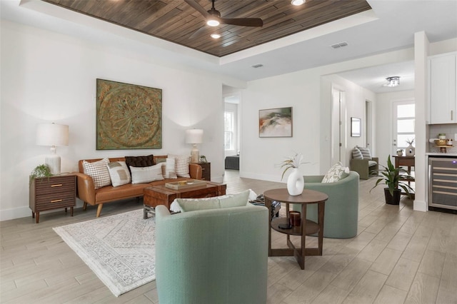 19 Essex Ln, Palm Coast, FL 32164 - living area featuring wooden ceiling, a raised ceiling, beverage cooler, visible vents, and ceiling fan