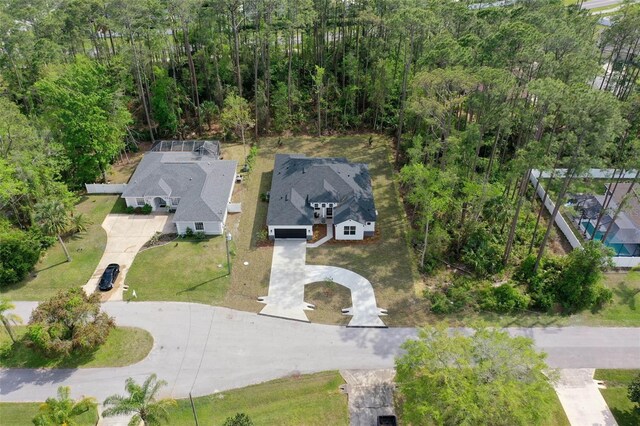 19 Essex Ln, Palm Coast, FL 32164 - birds eye view of property with a wooded view