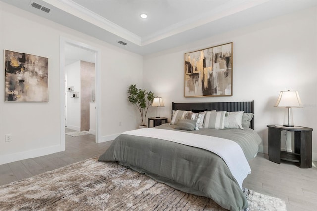 19 Essex Ln, Palm Coast, FL 32164 - bedroom with visible vents, wood finished floors, ornamental molding, and a raised ceiling