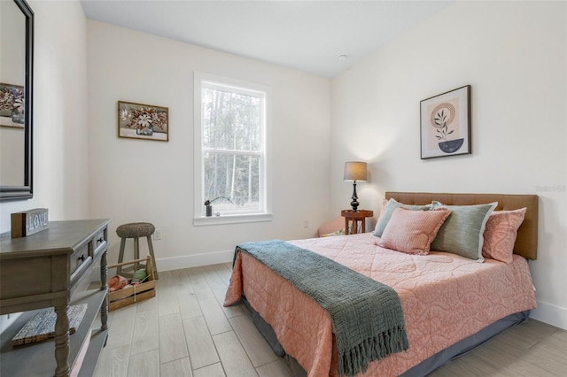 19 Essex Ln, Palm Coast, FL 32164 - bedroom with baseboards and light wood finished floors