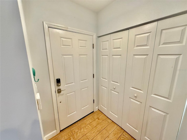 doorway to outside with light hardwood / wood-style flooring