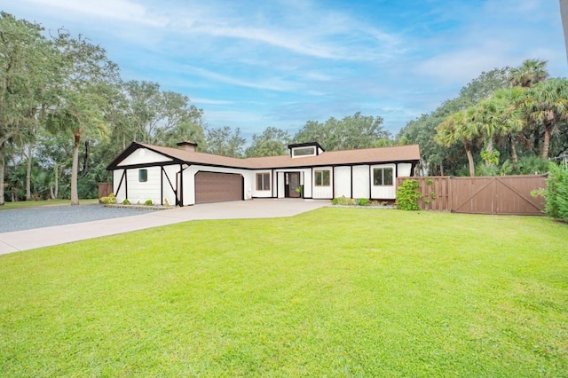 single story home featuring a front yard and a garage