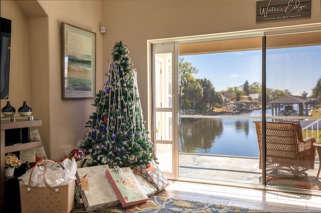 interior space featuring a water view and a healthy amount of sunlight