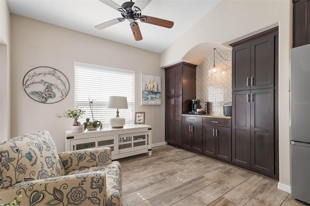 sitting room with light hardwood / wood-style floors and ceiling fan