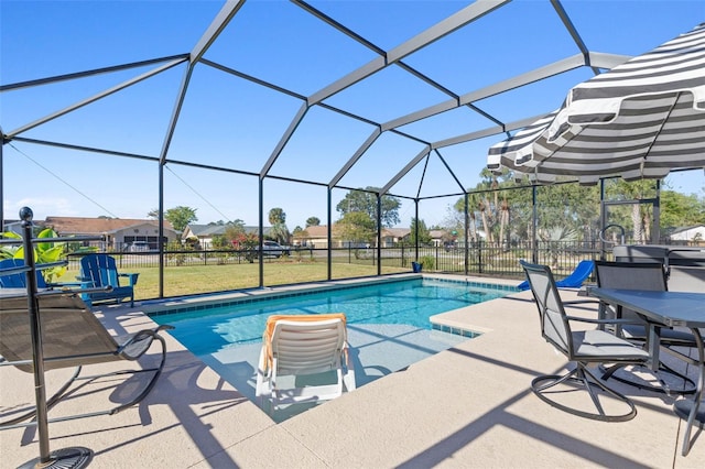 view of pool with a lanai, a yard, and a patio