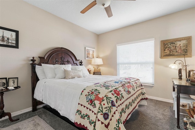 bedroom with ceiling fan and dark carpet