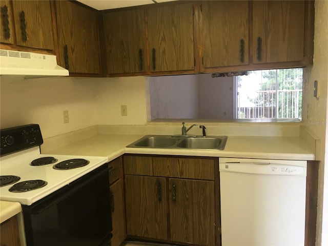 kitchen with white dishwasher, range with electric cooktop, and sink