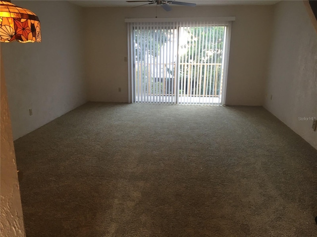 spare room with ceiling fan and carpet floors