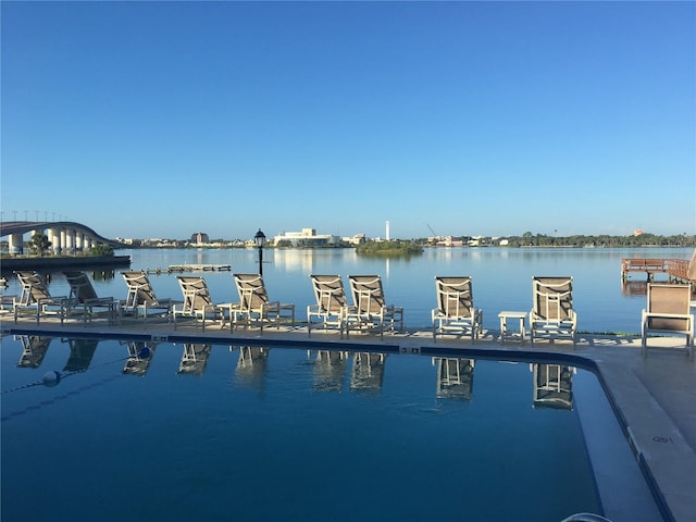 view of swimming pool with a water view