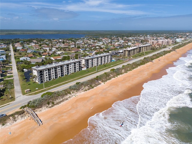 drone / aerial view with a view of the beach and a water view