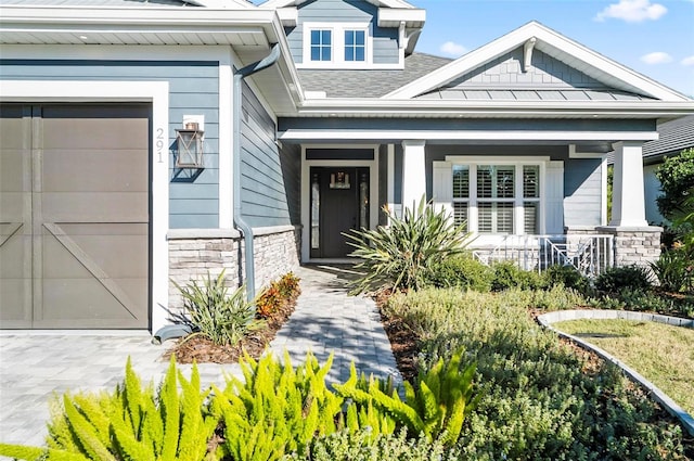 property entrance featuring covered porch