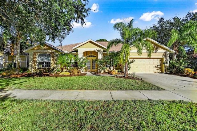 single story home featuring a front yard, french doors, and a garage